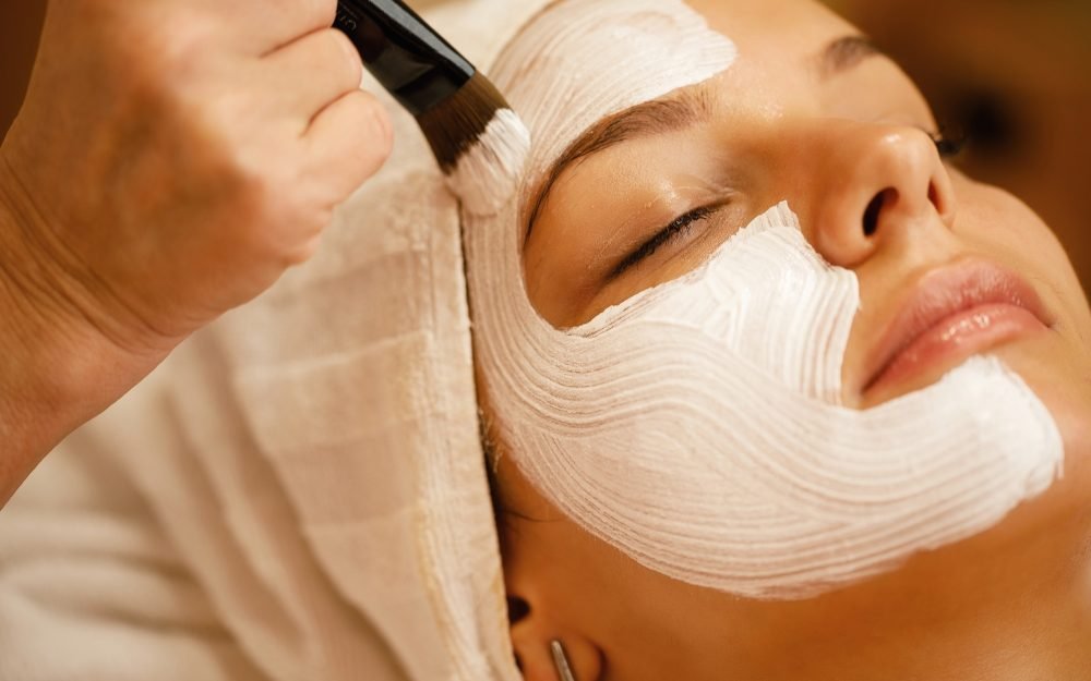 Close-up of facial treatment with detox mask.
